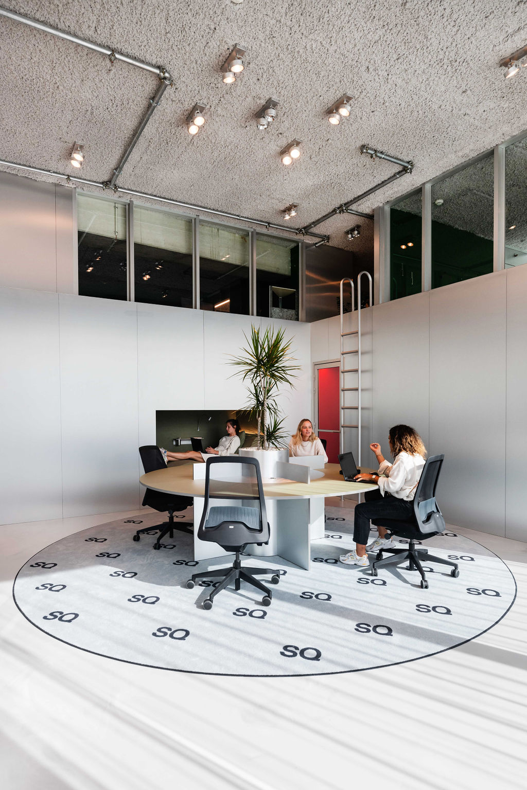 Team working together around a circular meeting table