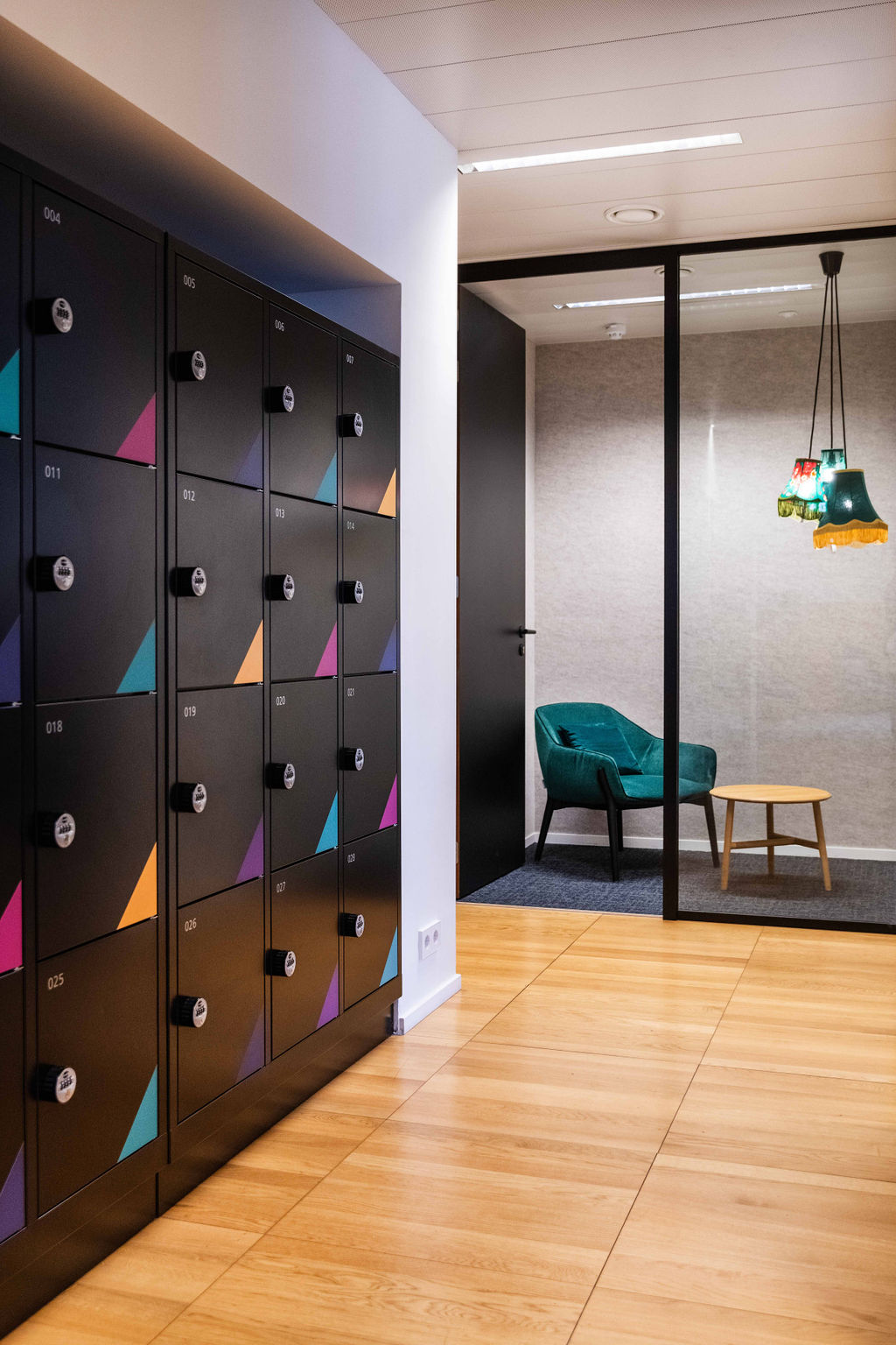 Colourful lockers next to a private phone booth